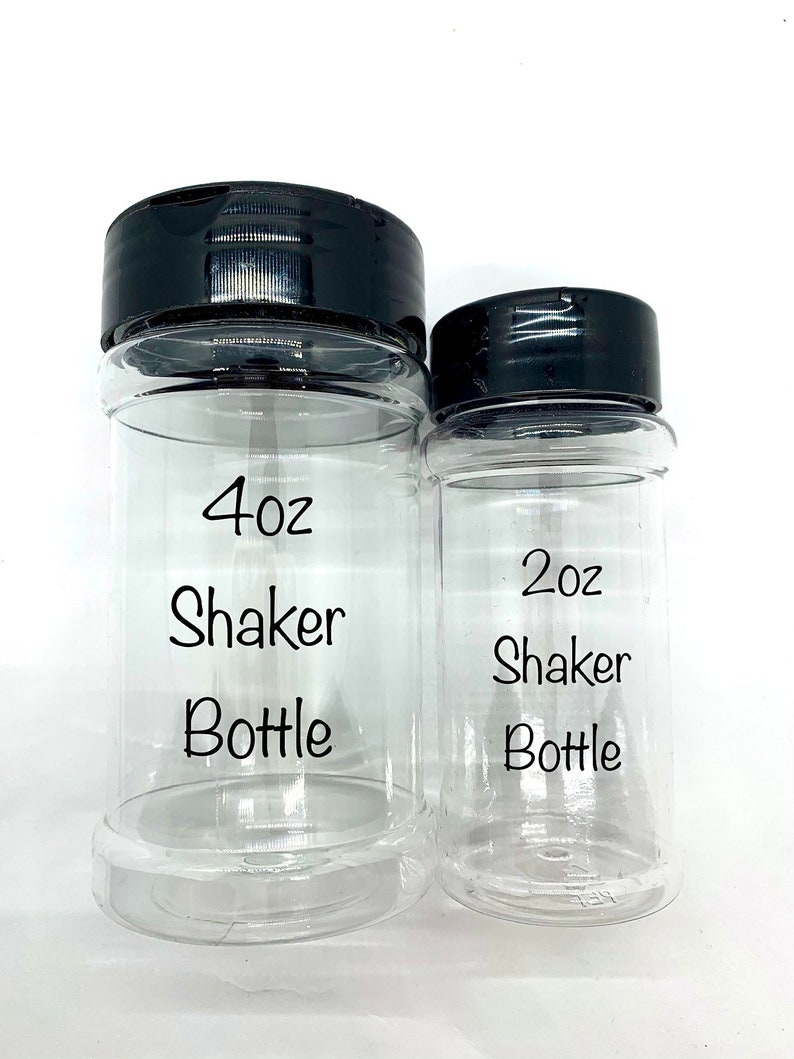 May include: Two clear plastic shaker bottles with black lids. The larger bottle is labeled "4oz Shaker Bottle" and the smaller bottle is labeled "2oz Shaker Bottle".