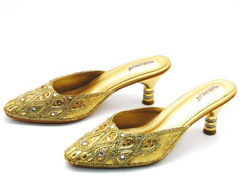 Bridal wedding shoes with heels in gold embroidery with rhinestones and beads and pointed toe Heels