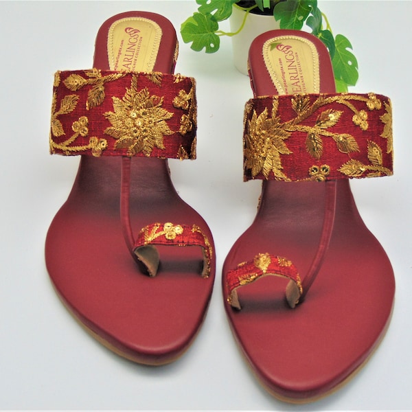 red with gold floral wedge heel with a floral design on heel toe ring braided strap