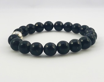 May include: A black beaded bracelet with a silver bead accent.