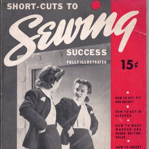 May include: A vintage book cover with a red background and white text that reads "Short-Cuts to Sewing Success Fully Illustrated 15¢". The cover features a black and white photo of two women wearing dresses and looking at a mirror. The text on the right side of the cover lists sewing tips, such as "How to cut, fit and adjust", "How to set in sleeves", "How to make worked and bound button-holes", "How to insert slide fasteners and zippers", "How to tailor a coat", and "And countless other helps".