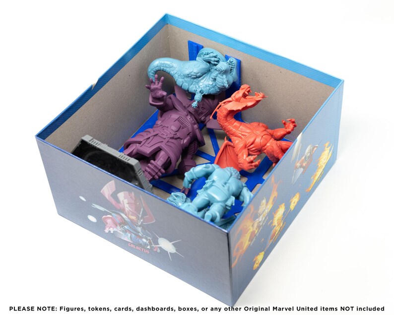 May include: A blue box with a cardboard insert for storing miniature figures. The box has a printed image of a superhero with a blue and red color scheme. The insert has slots for five figures, including a purple figure, a blue figure, a red figure, and two blue figures.