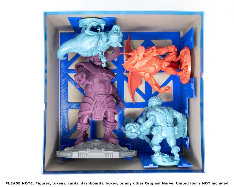 May include: A blue plastic storage box with four miniature figures inside. The figures are painted in different colors, including purple, red, blue, and green. The figures are standing on a gray base.