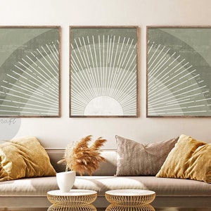 May include: Three framed prints with a minimalist design featuring a sunburst in shades of green and white.