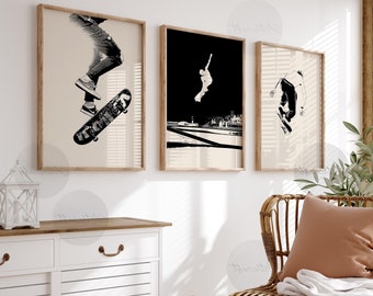 May include: Three black and white framed prints of skateboarders performing tricks. The prints are hung on a white wall above a white cabinet and a wicker chair with a brown pillow.