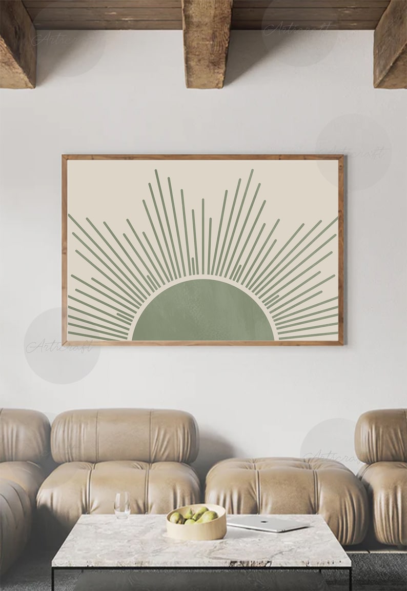 K&ouml;nnte beinhalten: Ein gerahmter Druck eines minimalistischen Sonnenmotivs mit gr&uuml;nen Linien, die von einem gr&uuml;nen Kreis auf einem beigefarbenen Hintergrund ausstrahlen.