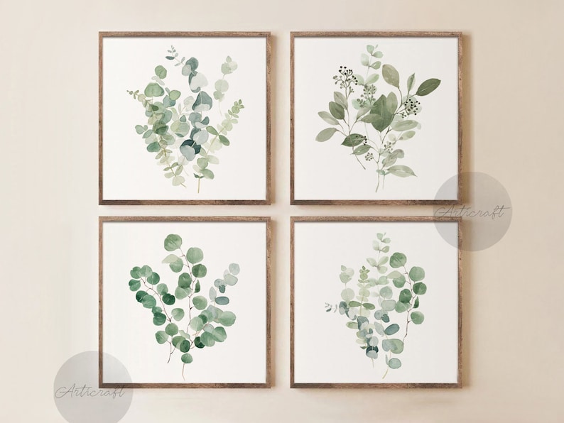 May include: Set of four framed watercolor prints featuring different arrangements of green eucalyptus leaves. The prints are displayed on a light beige wall.