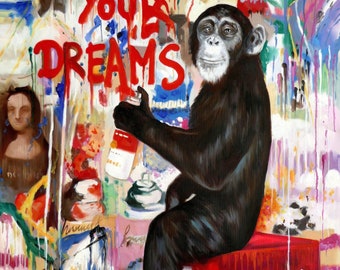 May include: A chimpanzee wearing a black shirt sits on a red box with the words "Coca-Cola" printed on it. The chimpanzee is holding a spray can and has painted the words "Follow Your Dreams" on a wall behind it. The wall is covered in colorful paint splatters.