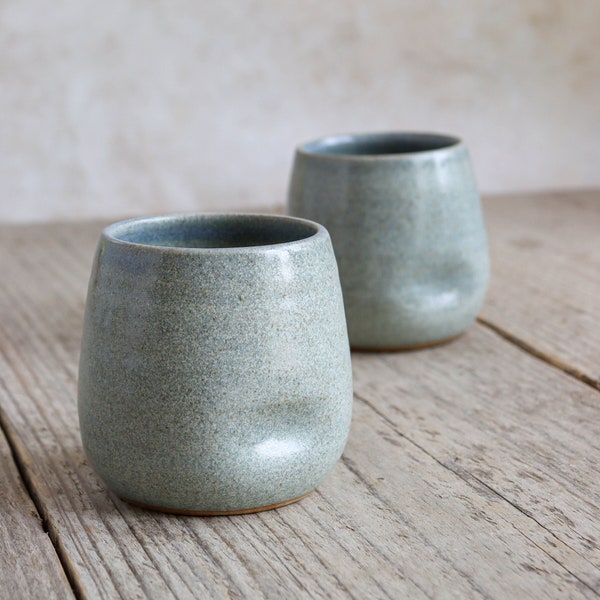 Handmade blue tumbler with dimples, handmade in ceramic stoneware pottery thumb cup beaker