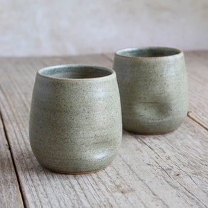 Sage green tumbler with dimple, hand made in stoneware pottery, thumb cup beaker