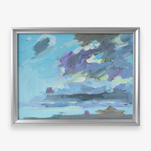 May include: A framed painting of a cloudy sky. The artwork features a vibrant palette of blues, purples, and grays, with brushstrokes creating a textured effect. The painting is encased in a silver frame, enhancing its visual appeal.