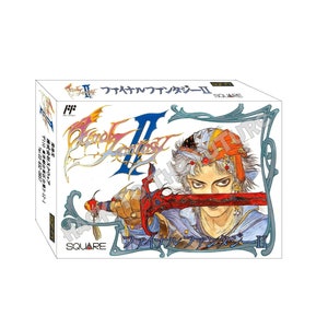 May include: A white box with a blue and red illustration of a character holding a sword. The box is for the video game "Final Fantasy II" and has the text "ファイナルファンタジーII" on the front.
