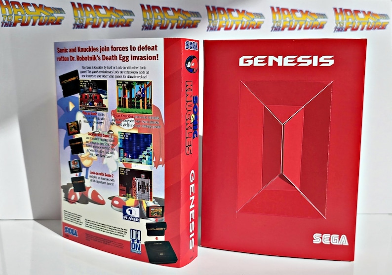 K&ouml;nnte beinhalten: Rote SEGA Genesis-Spielbox f&uuml;r "Sonic and Knuckles". Die Box zeigt Spiel-Screenshots, das SEGA-Logo und den Text "Sonic and Knuckles join forces to defeat Dr. Robotnik's Death Egg invasion!"