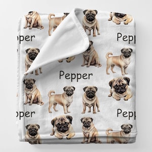 May include: White fleece blanket featuring a repeating pattern of tan pugs in various poses. The word "Pepper" is printed in black on the blanket. A cozy and decorative item for dog lovers.