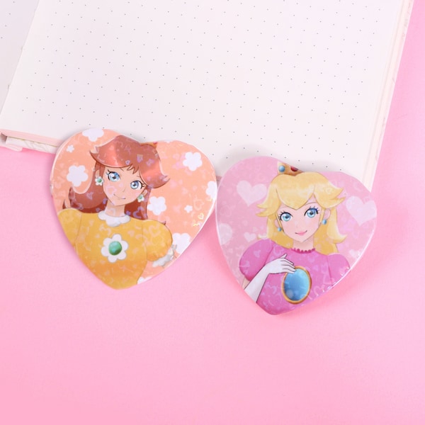 Spille per bottoni a forma di cuore della Principessa Peach e della Principessa Daisy