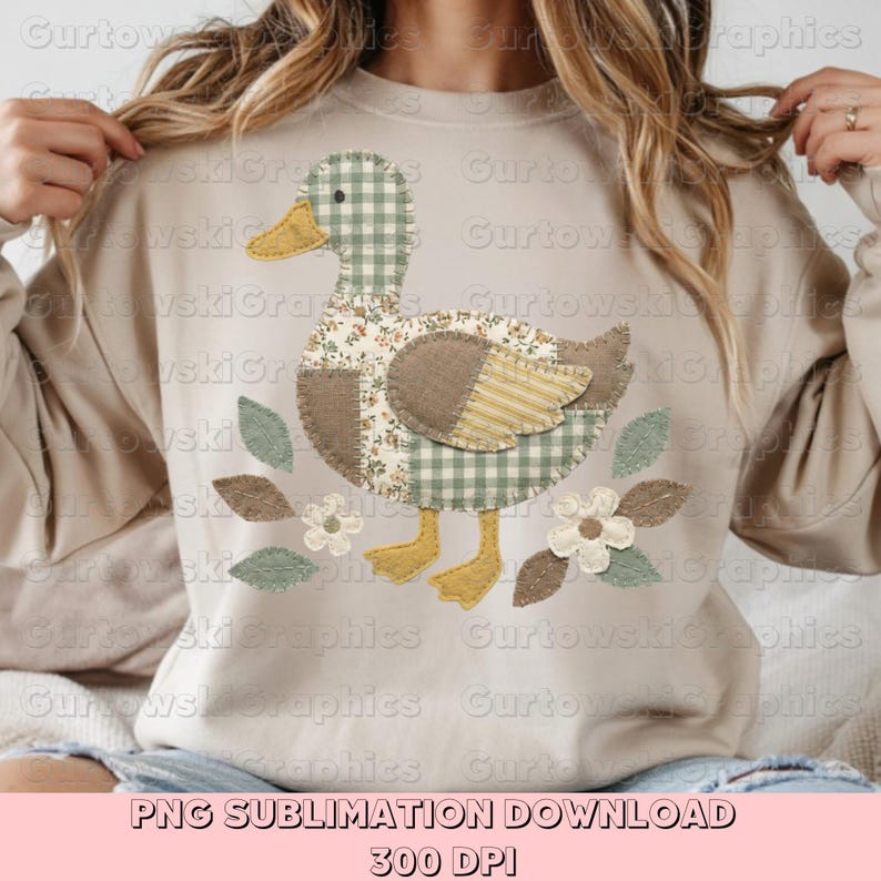 May include: A beige sweatshirt featuring a patchwork duck design. The duck has a checkered green and white head, floral and striped wings, and yellow feet. The design includes leaves and flowers. Text at the bottom reads "PNG SUBLIMATION DOWNLOAD 300 DPI."
