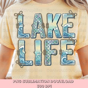 May include: A light yellow t-shirt featuring the words "LAKE LIFE" in a blue and teal design. The letters are outlined with rope and decorated with waves and mermaid scales. The text "PNG SUBLIMATION DOWNLOAD 300 DPI" is at the bottom.