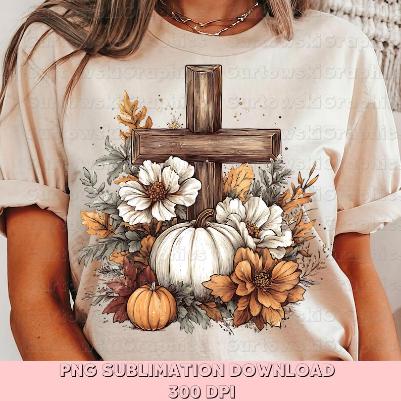 May include: Beige t-shirt featuring a wooden cross design with a white pumpkin, orange pumpkins, and flowers. The design includes fall foliage and the text "PNG SUBLIMATION DOWNLOAD 300 DPI".