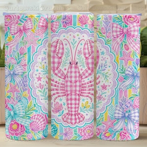 May include: A cylindrical tumbler featuring a repeating pattern of a pink gingham lobster centered within a scalloped lace frame. The design includes pastel-colored bows, seashells, starfish, and floral elements against a striped background.