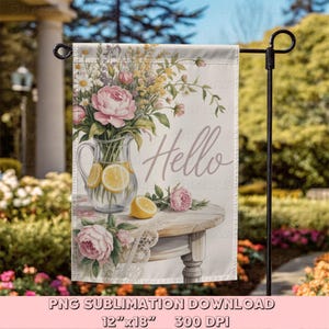 May include: A garden flag featuring a watercolor design with a floral arrangement in a glass pitcher with lemon slices. The word "Hello" is written in a script font. The flag is 12" x 18".
