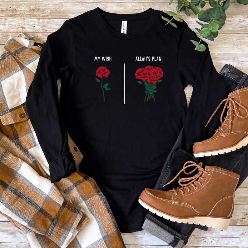 May include: Black long-sleeve t-shirt with the text "My Wish" and "Allah's Plan" printed on it. The text is accompanied by a single red rose and a bouquet of red roses.