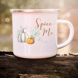 May include: White enamel mug with a brown "Spice Me" text and a watercolor illustration of two pumpkins with green vines.