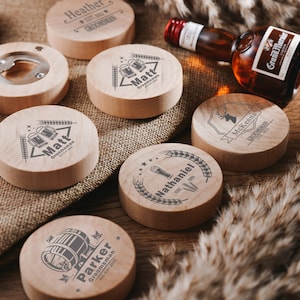 May include: Set of eight wooden bottle openers with different names and designs. Each opener features a unique design, including a beer mug, a deer, and a barrel. The openers are made of natural wood and have a rustic look.