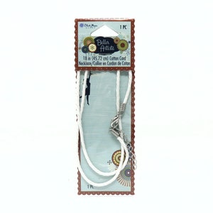 May include: White cotton cord necklace with silver clasp. The packaging shows the brand name "Bella Artiste" and the length of the cord is 18 inches (45.72 cm).