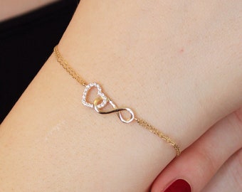 Pulsera de oro macizo de 14 quilates con corazón entrelazado e infinito: dije de amor eterno con pavé de circonitas cúbicas.