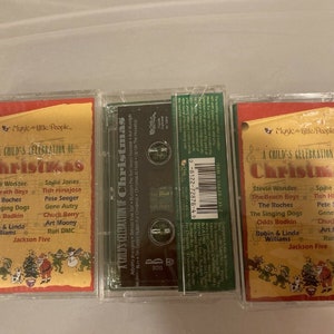 May include: Three cassette tapes of "A Child's Celebration of Christmas" by various artists. The cassette cases are clear plastic, and the covers are red and yellow with festive illustrations and artist names.