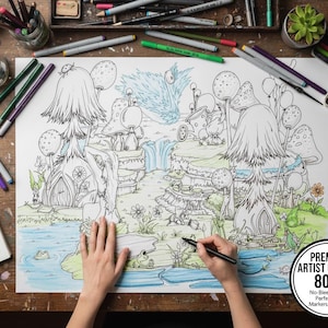 Puede incluir: Una persona colorea una detallada ilustración de fantasía con un bolígrafo negro. La obra presenta casas de hongos caprichosas, una cascada y una rana en un estanque. El papel está etiquetado como "Premium Artist Quality 80LB". Alrededor de la obra hay lápices de colores, rotuladores y una paleta de acuarelas.