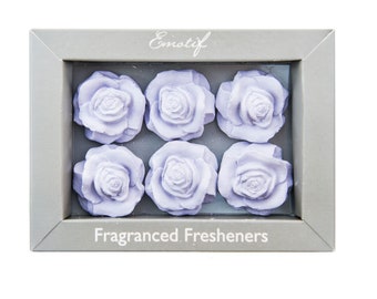 May include: Six lavender-colored rose-shaped air fresheners in a gray box with the text "Emotif Fragranced Fresheners".