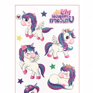 May include: Sheet of colorful unicorn temporary tattoos. The unicorns have white bodies, pink hooves, and multi-colored manes and tails. Some have wings, crowns, or flowers. The text "Unicorn Magical" is also included.