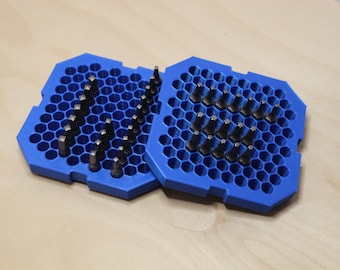 May include: Two blue plastic trays with hexagonal compartments, each filled with a variety of small metal screwdriver bits.