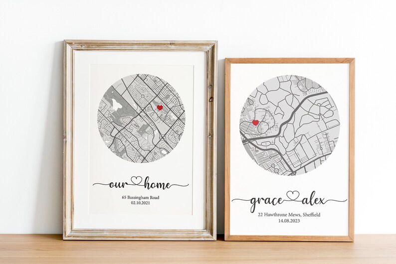 May include: Two framed prints with maps of different locations. The first print says "our home" with a red heart and the address "65 Rustingham Road, 02.10.2021". The second print says "grace alex" with a red heart and the address "22 Hawthorne Mews, Sheffield, 14.08.2023".