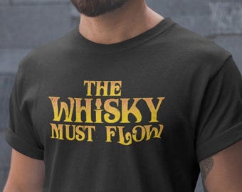 May include: Black t-shirt with a yellow and orange graphic that says "The Whisky Must Flow".