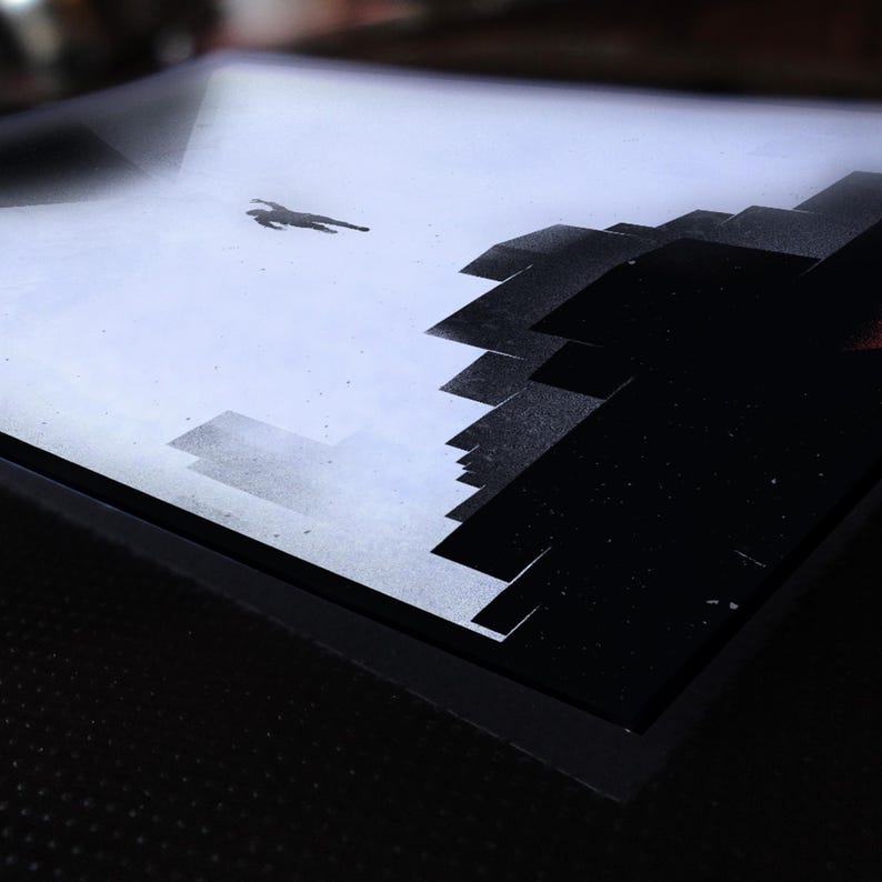 May include: A black and white abstract painting on a canvas with a black frame. The painting depicts a figure falling from the sky towards a city skyline.
