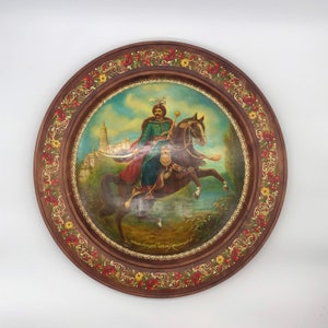A wooden plate with the image of Bohdan Khmelnytskyi