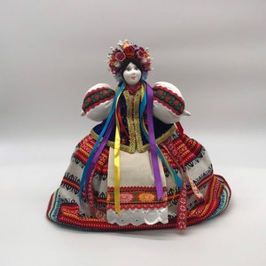 Ukrainian doll on a teapot