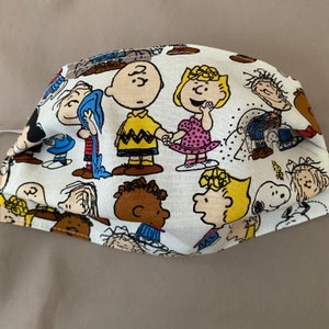 Charlie brown and peanut gang face cover with adjustable elastic ear strap