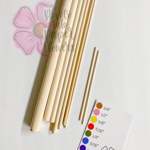 May include: Assortment of wooden dowels in various sizes, ranging from 1/8 inch to 3/4 inch. The dowels are arranged in order of size, with the smallest dowel at the bottom and the largest dowel at the top. A color chart is included to help identify the size of each dowel.