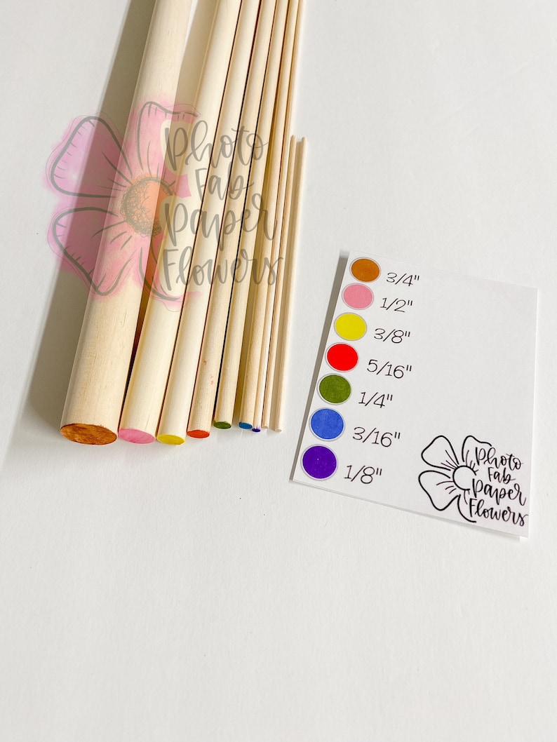 May include: Assortment of wooden dowels in various sizes, ranging from 1/8 inch to 3/4 inch. The dowels are painted with different colored dots to indicate their size. The dowels are labeled with their size in inches. The image also includes the text "Photo Fab Paper Flowers".