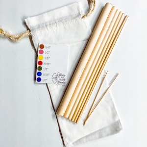 May include: A set of 10 natural bamboo skewers in a white drawstring bag. The skewers are various lengths, ranging from 1/8 inch to 3/4 inch. A color chart is included to show the different sizes.