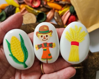 Harvest themed painted pebbles for loose parts play
