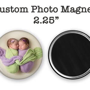 May include: Custom photo magnet featuring two newborn babies wrapped in purple and green blankets, sleeping and touching noses. The magnet is 2.25 inches in diameter.