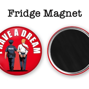 May include: A red fridge magnet with the text "I HAVE A DREAM" encircling an illustration of a police officer escorting a man in handcuffs. The magnet's reverse side is black. The words "Fridge Magnet" are above the magnet.