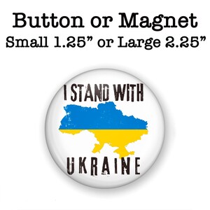 May include: A white button or magnet with the text "I Stand With Ukraine" and an outline of the country of Ukraine in blue and yellow. The button is available in two sizes: 1.25 inches or 2.25 inches.