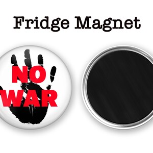 May include: A white round fridge magnet with a black handprint and the words "NO WAR" in red letters.