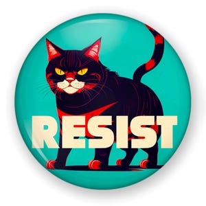 May include: A round teal button with a black cat illustration. The cat has red accents and yellow eyes. The word "RESIST" is printed in white block letters across the bottom of the button.