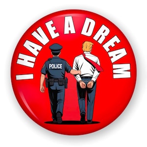May include: A red button with the text "I HAVE A DREAM" in white. The image depicts a police officer escorting a man in handcuffs. The man is wearing a white shirt and red tie.